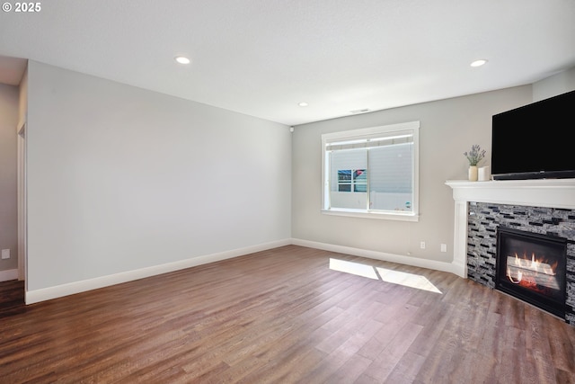 1522 NE Sunrise Ln, Hillsboro, OR 97124 - unfurnished living room with recessed lighting, baseboards, wood finished floors, and a fireplace