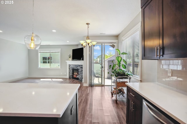 1522 NE Sunrise Ln, Hillsboro, OR 97124 - kitchen featuring light countertops, plenty of natural light, wood finished floors, and dishwasher
