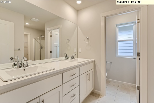 bathroom featuring tile patterned floors, vanity, toilet, and walk in shower