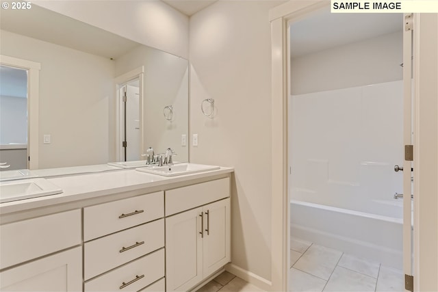 bathroom with tile patterned flooring, vanity, and tub / shower combination