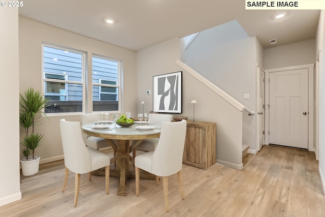 dining space featuring light hardwood / wood-style floors