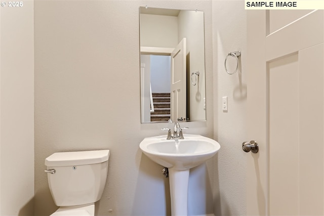 bathroom featuring toilet