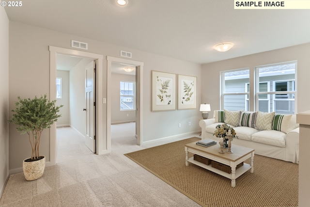 living room with light colored carpet