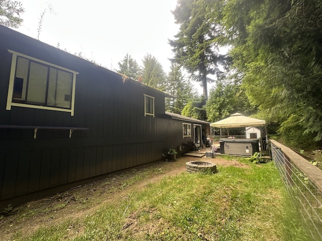585 Robinhood Ave, Lakeside, OR 97449 - view of yard featuring a hot tub, a fire pit, and a gazebo