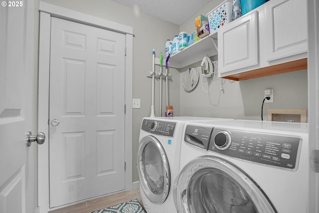 2805 Knox Ridge Ter, Forest Grove, OR 97116 - laundry area featuring cabinet space, washer and clothes dryer, and a textured ceiling