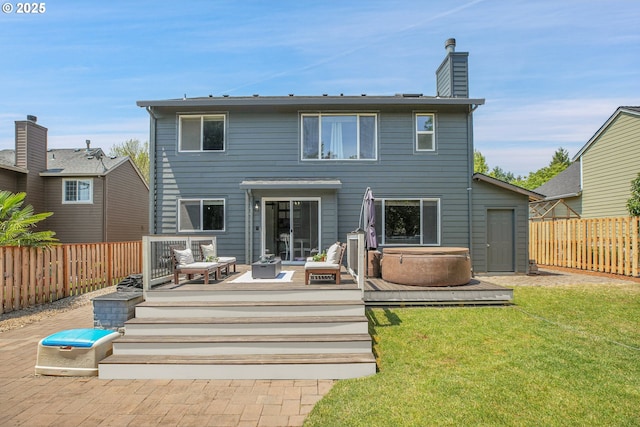 2805 Knox Ridge Ter, Forest Grove, OR 97116 - back of property featuring a deck, a hot tub, a fenced backyard, a chimney, and an outdoor living space