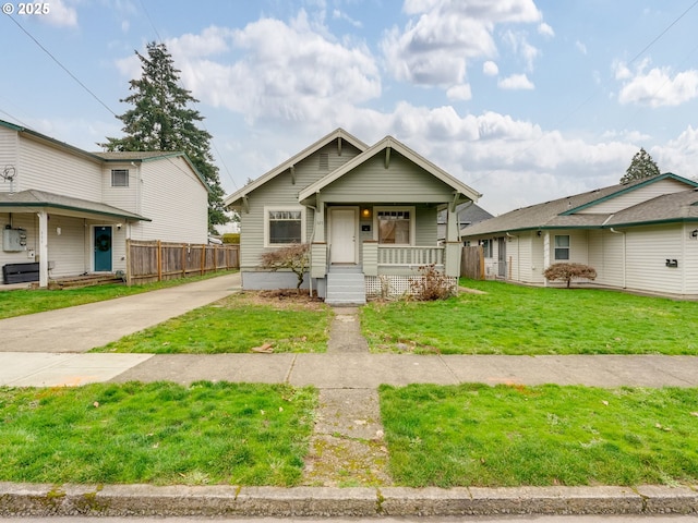 view of front of home featuring covered porch and a front yard