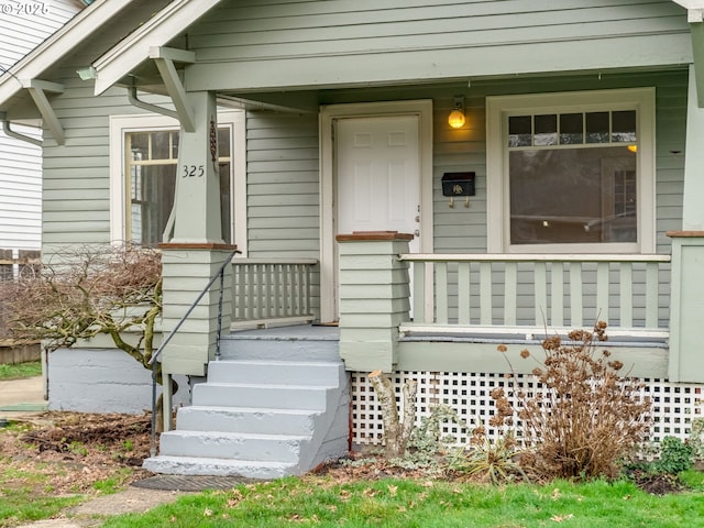 property entrance featuring covered porch