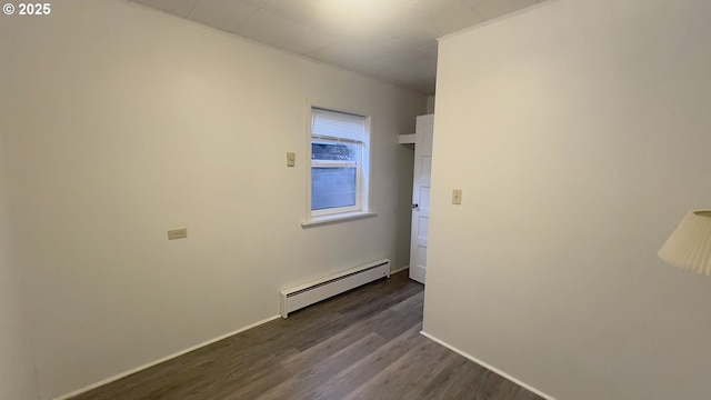 unfurnished room with a baseboard radiator, dark wood-style flooring, and baseboards