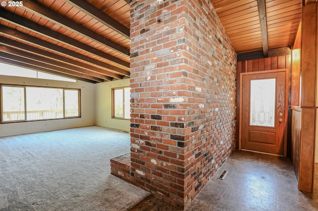 interior space with visible vents, vaulted ceiling with beams, and wooden ceiling