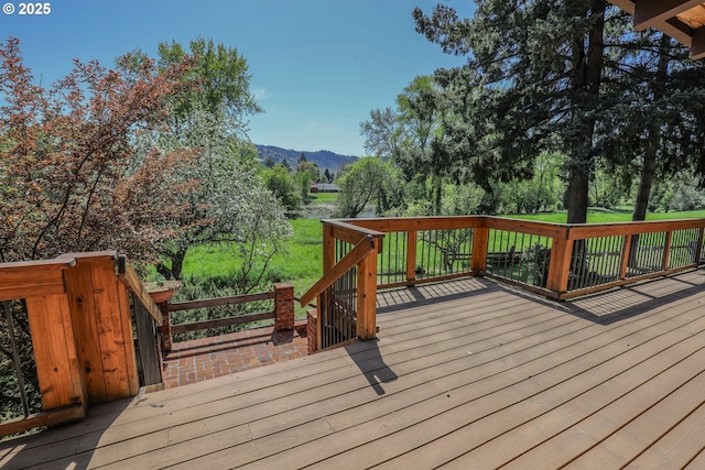 wooden deck with a mountain view