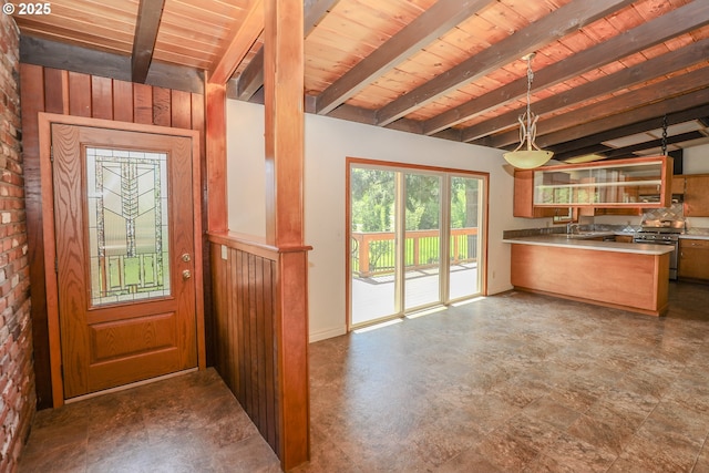 kitchen featuring stainless steel stove, wood ceiling, pendant lighting, a peninsula, and beam ceiling