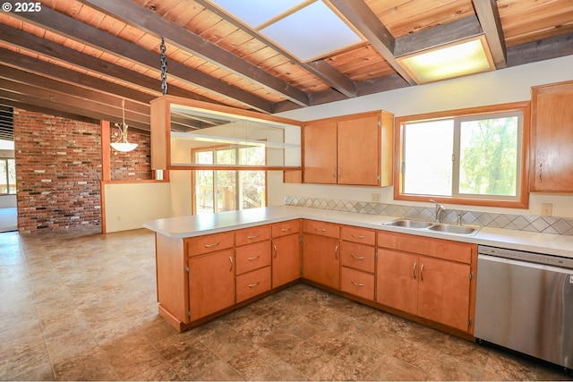 kitchen with light countertops, dishwasher, wooden ceiling, and a sink