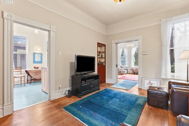 living room featuring hardwood / wood-style floors and a chandelier