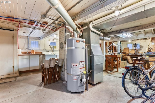 utility room with heating unit and secured water heater