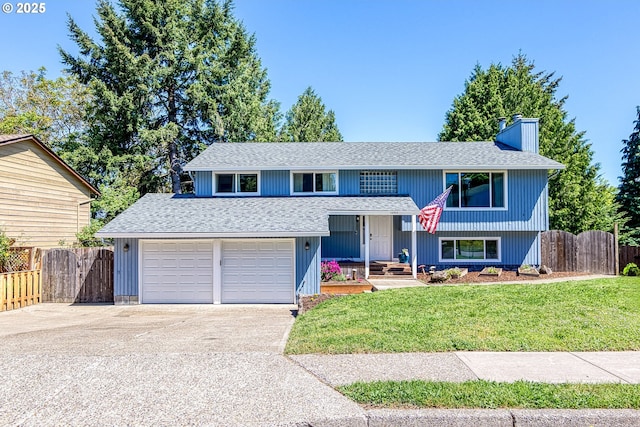 split foyer home with a chimney, a shingled roof, concrete driveway, and a garage
