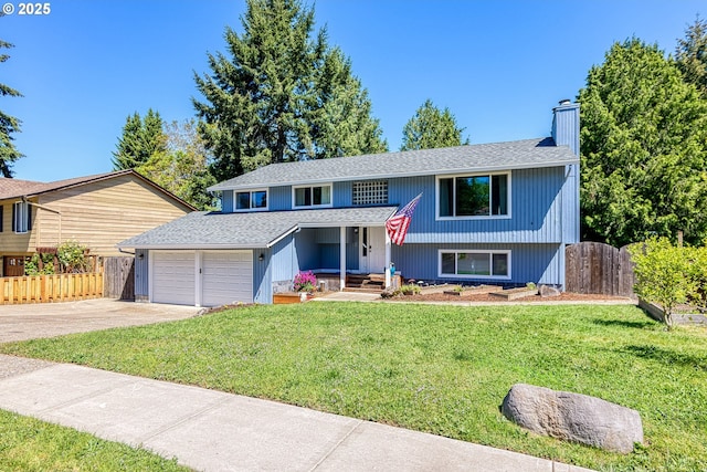 bi-level home featuring a chimney, an attached garage, a shingled roof, and concrete driveway