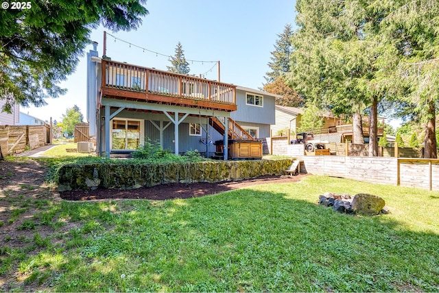 rear view of house featuring stairs, a wooden deck, and central AC unit
