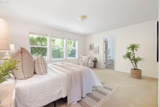 carpeted bedroom with baseboards