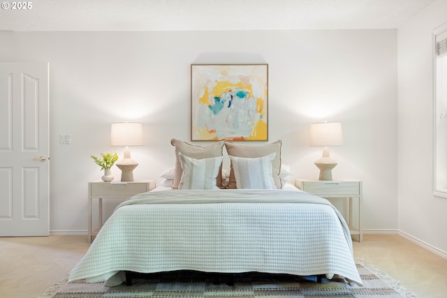 carpeted bedroom with baseboards