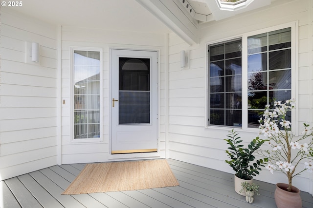 property entrance with a deck