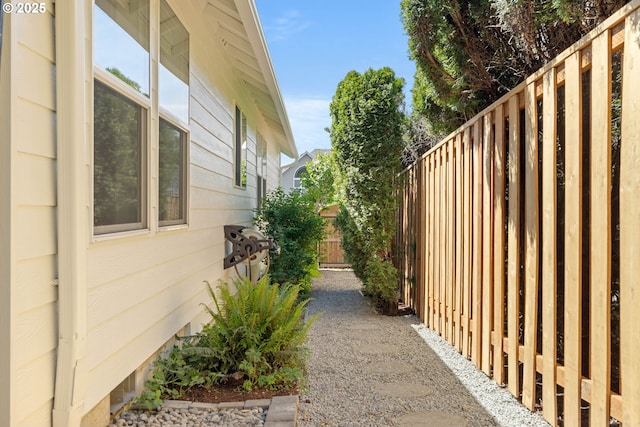 view of side of home with fence