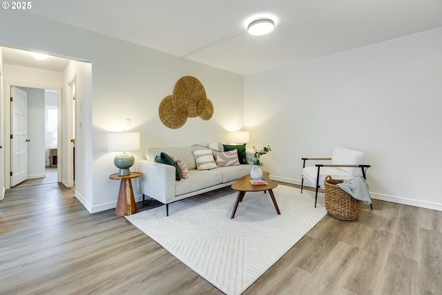 2021 SW Main St Unit 66, Portland, OR 97205 - living room featuring wood finished floors and baseboards