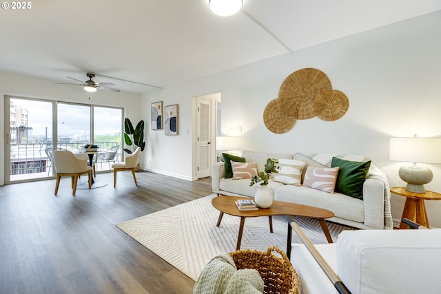2021 SW Main St Unit 66, Portland, OR 97205 - living area featuring ceiling fan, wood finished floors, and baseboards