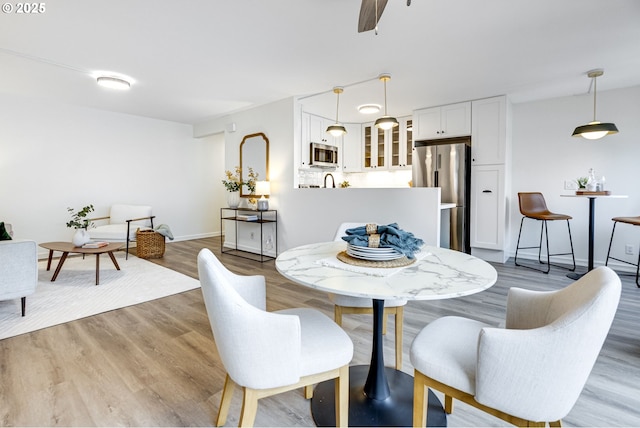 2021 SW Main St Unit 66, Portland, OR 97205 - dining space with wood finished floors