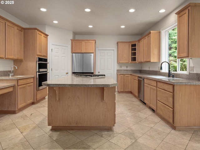 3165 SW Garden View Ave, Portland, OR 97225 - kitchen featuring stainless steel appliances, a sink, a kitchen island, recessed lighting, and glass insert cabinets
