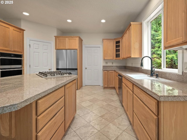 3165 SW Garden View Ave, Portland, OR 97225 - kitchen featuring stainless steel appliances, a sink, recessed lighting, light tile patterned floors, and glass insert cabinets