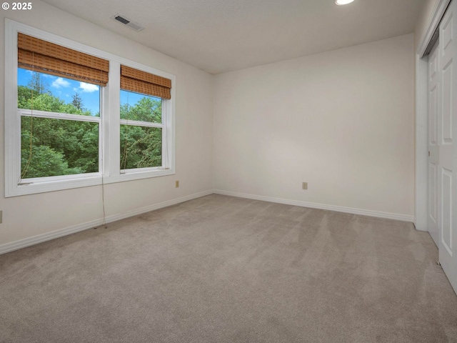 3165 SW Garden View Ave, Portland, OR 97225 - unfurnished bedroom with light colored carpet, baseboards, and a closet
