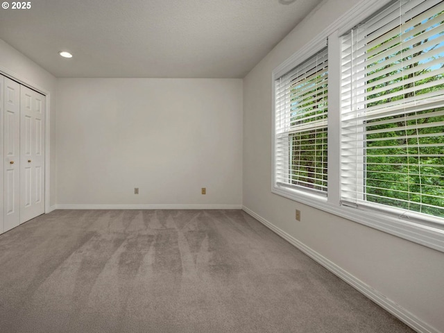 3165 SW Garden View Ave, Portland, OR 97225 - unfurnished bedroom featuring carpet flooring, baseboards, a closet, and recessed lighting