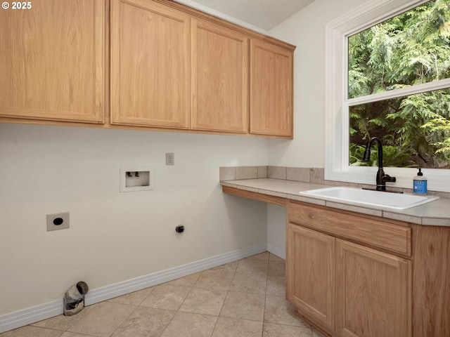 3165 SW Garden View Ave, Portland, OR 97225 - laundry room with hookup for an electric dryer, washer hookup, cabinet space, baseboards, and light tile patterned flooring