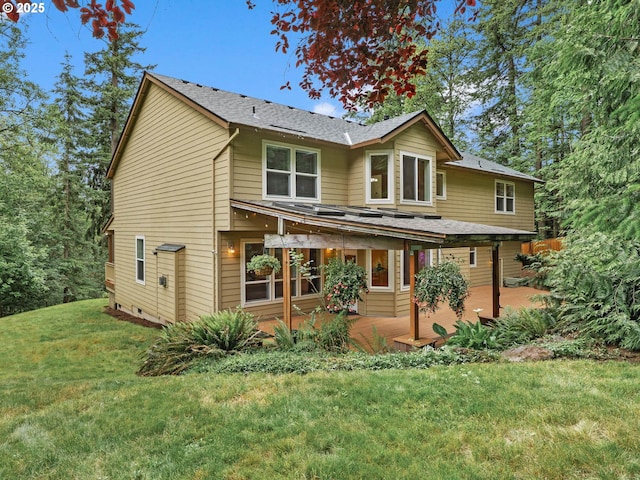 3165 SW Garden View Ave, Portland, OR 97225 - view of front of property with a front yard, a shingled roof, and a patio area