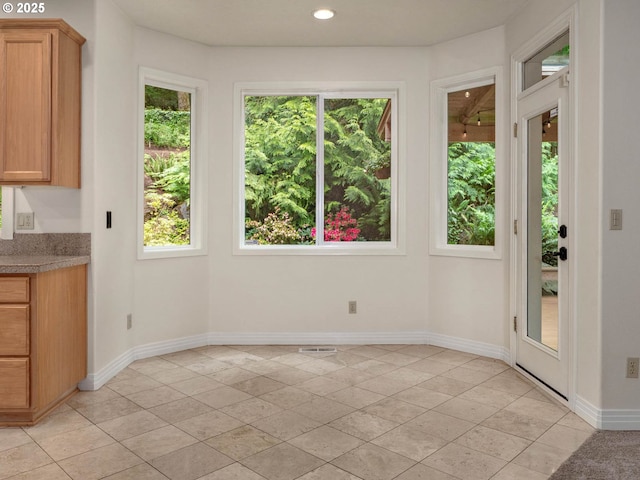 3165 SW Garden View Ave, Portland, OR 97225 - unfurnished dining area with baseboards, recessed lighting, and light tile patterned floors