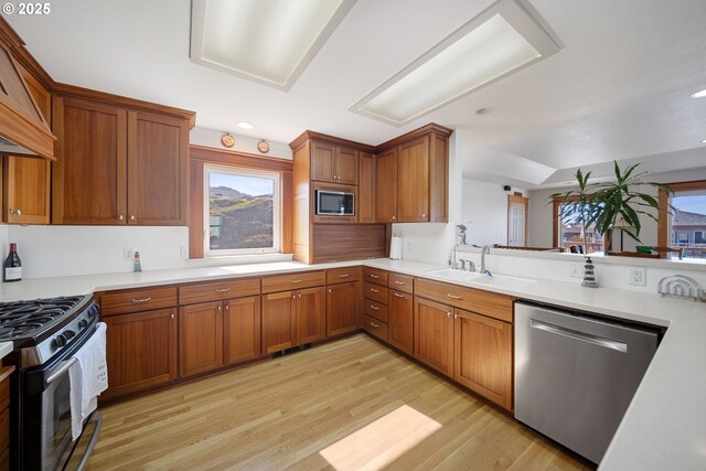 93885 Boulder Pl, Gold Beach, OR 97444 - kitchen with brown cabinets, light countertops, appliances with stainless steel finishes, and a sink