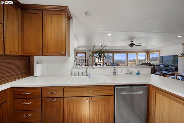 93885 Boulder Pl, Gold Beach, OR 97444 - kitchen featuring a sink, brown cabinetry, dishwasher, light countertops, and a ceiling fan