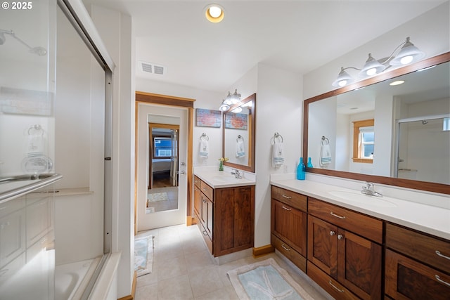 93885 Boulder Pl, Gold Beach, OR 97444 - ensuite bathroom featuring an enclosed shower, visible vents, two vanities, and a sink