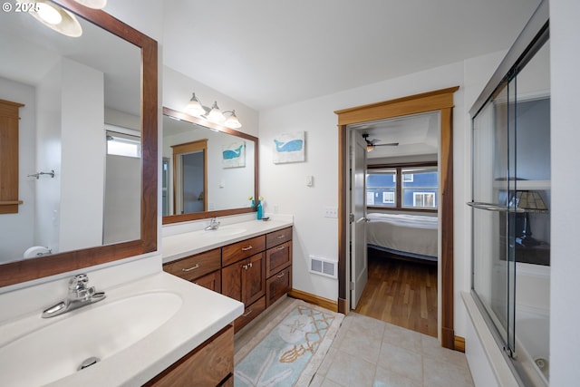 93885 Boulder Pl, Gold Beach, OR 97444 - ensuite bathroom with a shower with door, visible vents, baseboards, tile patterned flooring, and vanity