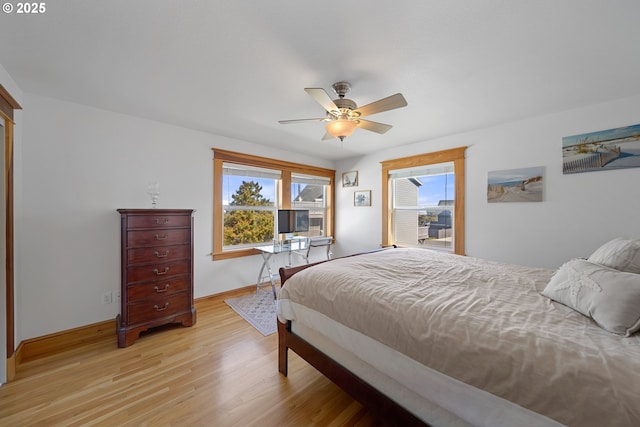 93885 Boulder Pl, Gold Beach, OR 97444 - bedroom with light wood-style flooring, baseboards, and a ceiling fan
