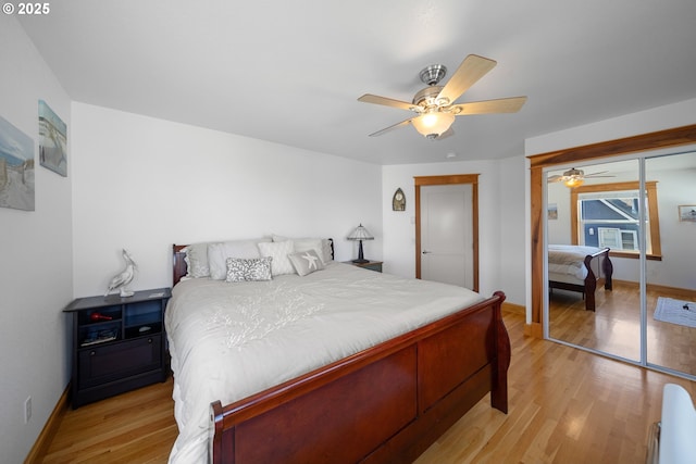 93885 Boulder Pl, Gold Beach, OR 97444 - bedroom featuring baseboards, light wood-style floors, a closet, and ceiling fan