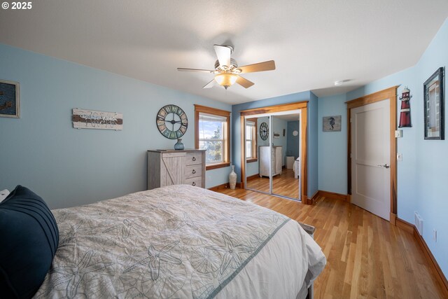 93885 Boulder Pl, Gold Beach, OR 97444 - bedroom with a closet, visible vents, light wood-style flooring, a ceiling fan, and baseboards