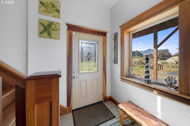 93885 Boulder Pl, Gold Beach, OR 97444 - doorway featuring tile patterned flooring, baseboards, and plenty of natural light