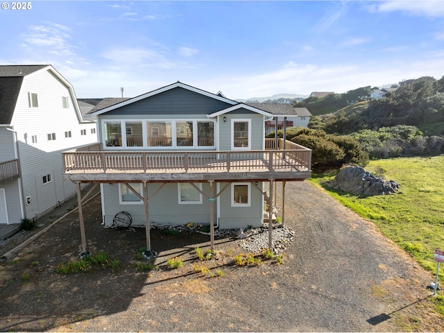 93885 Boulder Pl, Gold Beach, OR 97444 - view of front of house with roof with shingles, a deck, and driveway