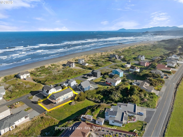 93885 Boulder Pl, Gold Beach, OR 97444 - drone / aerial view featuring a water view, a residential view, and a beach view