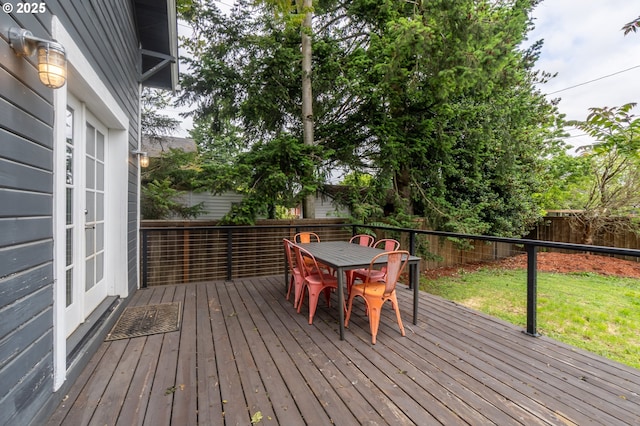 wooden terrace featuring outdoor dining area