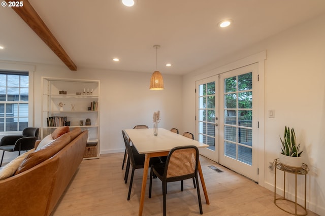 dining area with recessed lighting, light wood-style flooring, and beamed ceiling