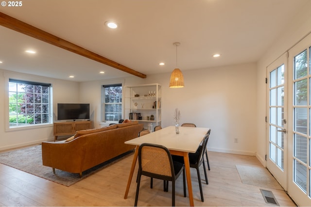 dining area featuring recessed lighting, beam ceiling, baseboards, and light wood-style flooring