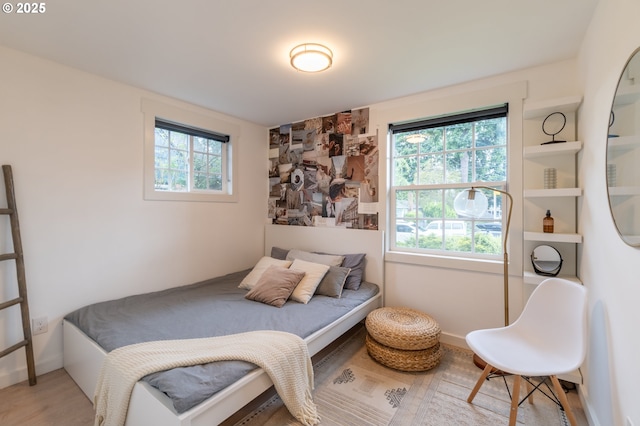 bedroom with wood finished floors